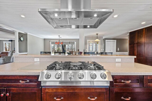 61914 M-51, Niles, MI 49120 - kitchen featuring light countertops, stovetop, wall chimney exhaust hood, and decorative light fixtures