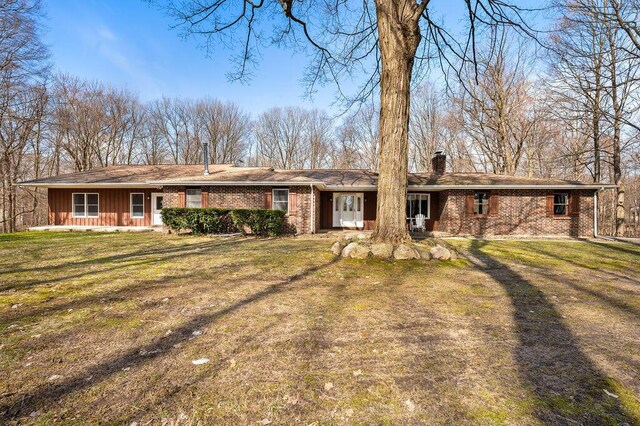 61914 M-51, Niles, MI 49120 - ranch-style house with a front lawn, brick siding, and a chimney