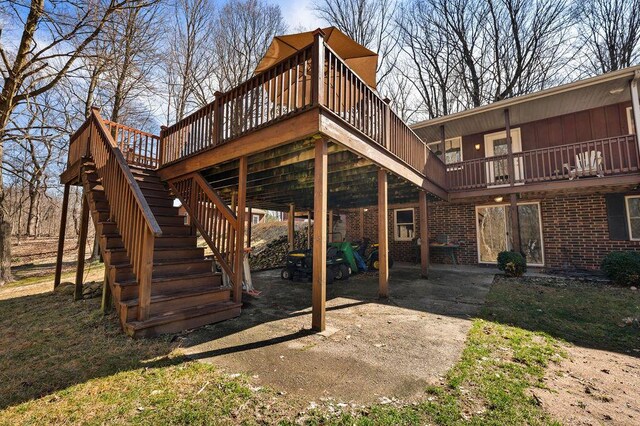 61914 M-51, Niles, MI 49120 - back of property with stairway, brick siding, and a deck