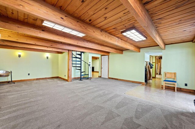 61914 M-51, Niles, MI 49120 - below grade area featuring baseboards, carpet, wooden ceiling, and stairs