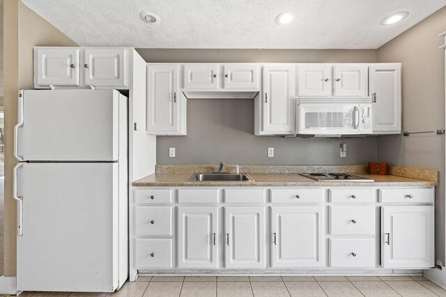 61914 M-51, Niles, MI 49120 - kitchen featuring a sink, white appliances, and white cabinetry
