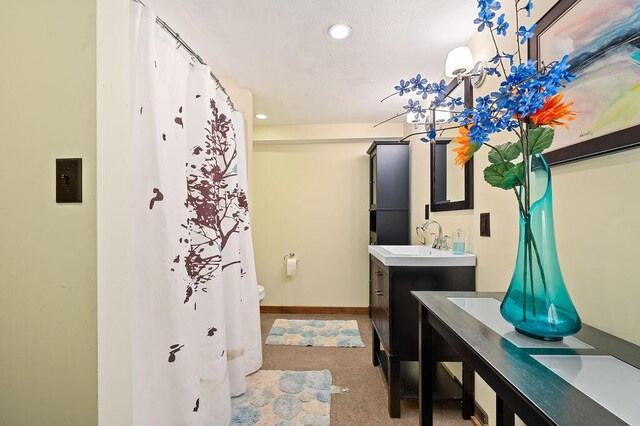 61914 M-51, Niles, MI 49120 - bathroom featuring vanity, baseboards, recessed lighting, curtained shower, and toilet