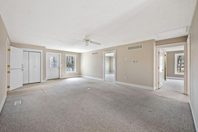 61914 M-51, Niles, MI 49120 - interior space featuring light carpet, visible vents, and a ceiling fan