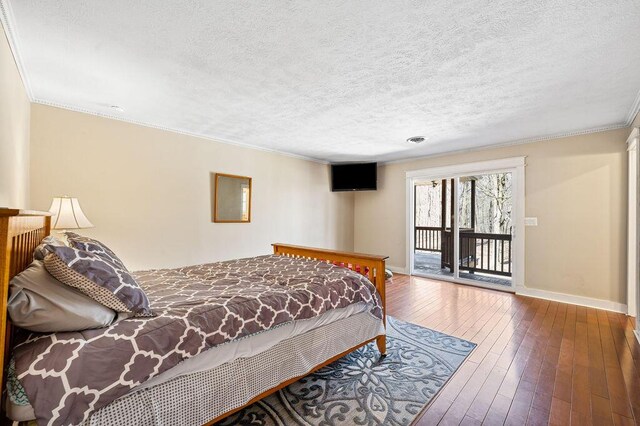 61914 M-51, Niles, MI 49120 - bedroom featuring hardwood / wood-style flooring, crown molding, baseboards, and access to outside