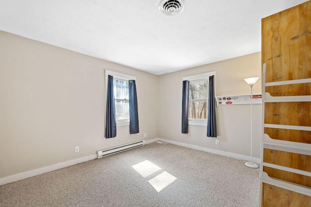61914 M-51, Niles, MI 49120 - carpeted empty room featuring baseboard heating, a healthy amount of sunlight, baseboards, and visible vents