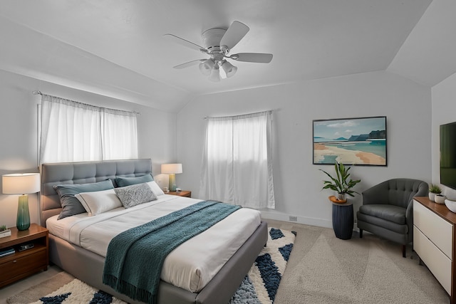 bedroom with multiple windows, lofted ceiling, baseboards, and ceiling fan