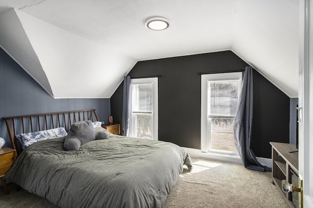 carpeted bedroom featuring vaulted ceiling