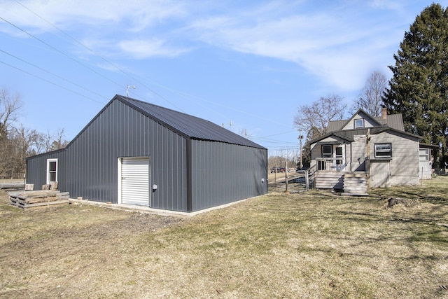 view of outbuilding featuring an outbuilding and driveway