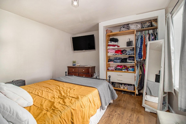 bedroom featuring a closet and wood finished floors