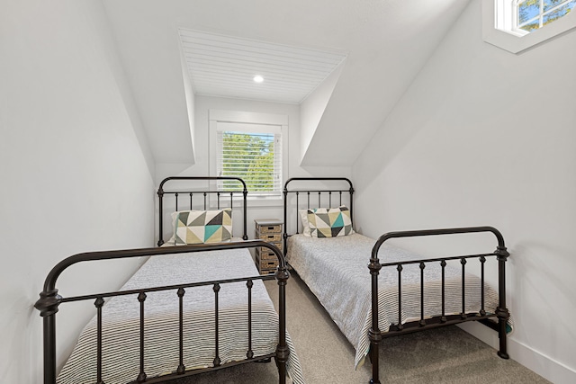 carpeted bedroom featuring baseboards