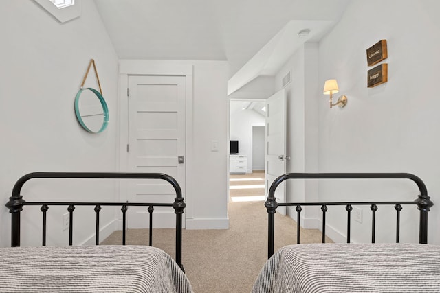 bedroom featuring carpet flooring, baseboards, and visible vents
