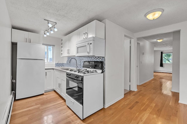 603 Gott St, Ann Arbor, MI 48103 - kitchen featuring white appliances, a baseboard radiator, white cabinets, and a textured ceiling