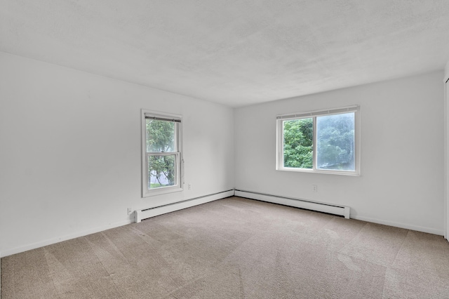 603 Gott St, Ann Arbor, MI 48103 - carpeted spare room with plenty of natural light, a baseboard heating unit, and baseboards