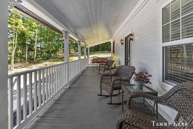 wooden terrace featuring a porch