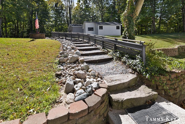 view of yard featuring an outbuilding and fence