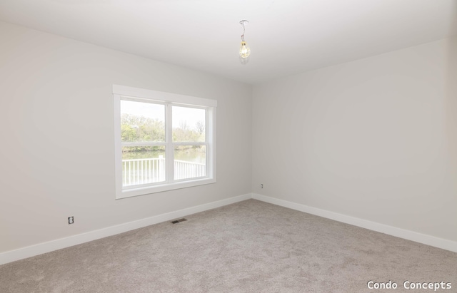 6627 Shoreside Ct SE, Grand Rapids, MI 49548 - spare room with carpet and baseboards