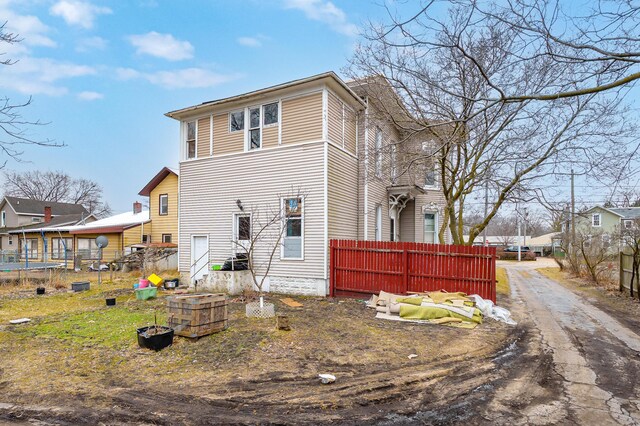240 S Main St, Three Rivers, MI 49093 - view of side of home featuring fence