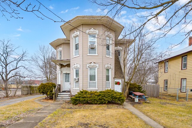 240 S Main St, Three Rivers, MI 49093 - view of front of property featuring a front yard, cooling unit, and fence