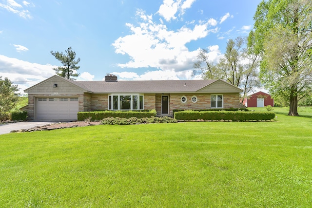 ranch-style home with driveway, an attached garage, a chimney, and a front lawn