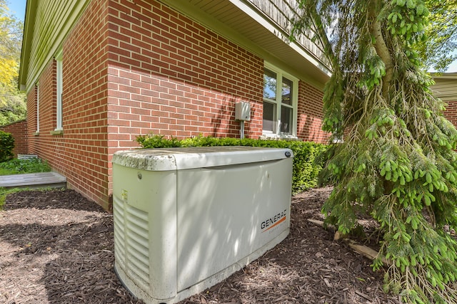 exterior details with brick siding and a power unit