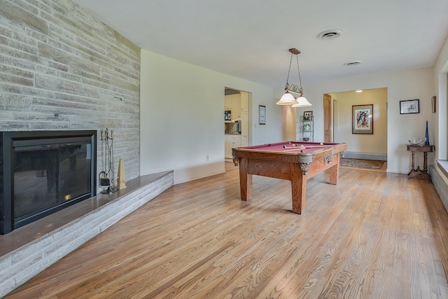 rec room featuring visible vents, a large fireplace, pool table, and light wood finished floors