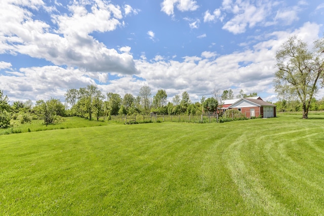 view of yard with a rural view