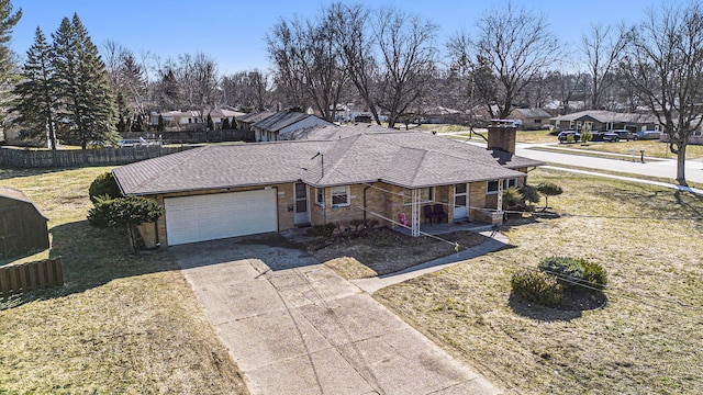 view of front of house with concrete driveway, fence, a garage, and roof with shingles