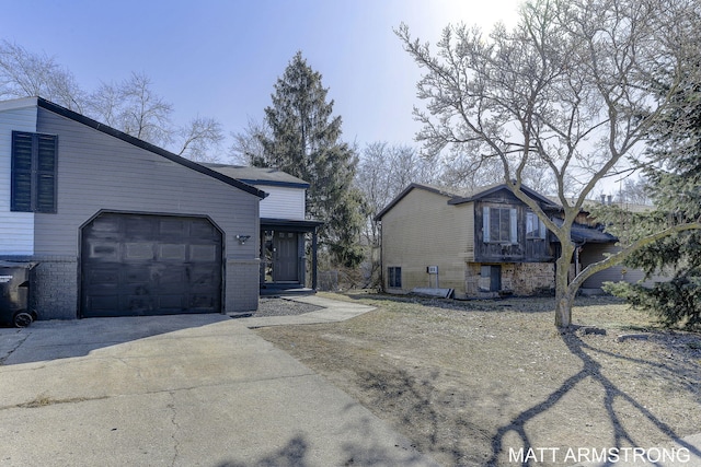 view of front of house with brick siding, concrete driveway, and an attached garage