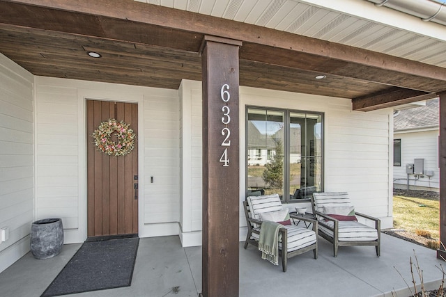 view of exterior entry featuring a porch