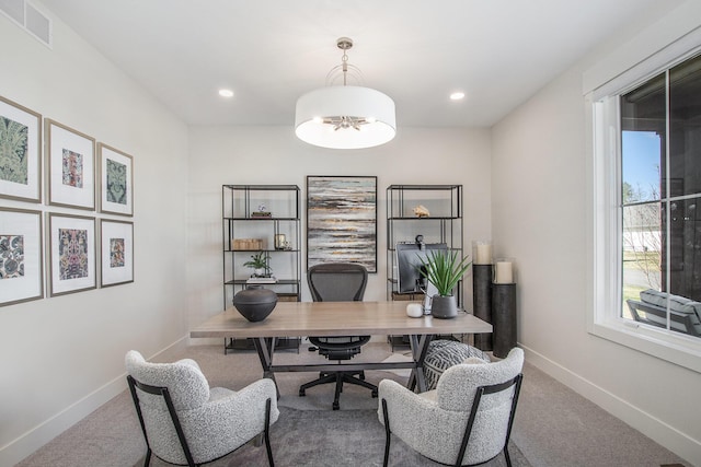 office area featuring visible vents, an inviting chandelier, baseboards, and carpet floors