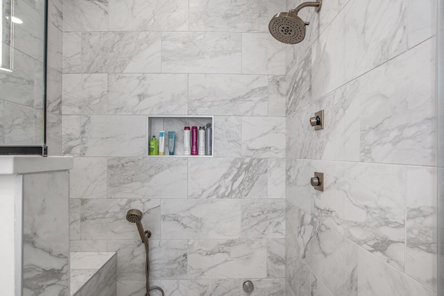 full bathroom featuring a tile shower