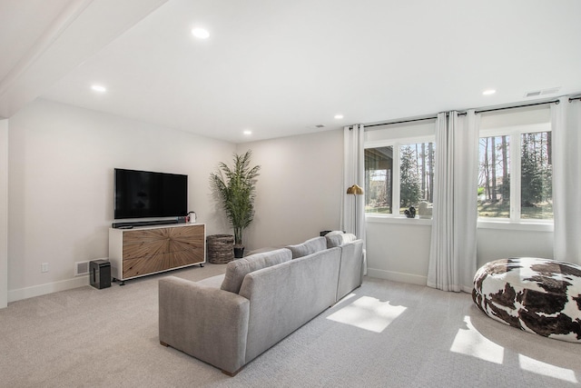 living room with recessed lighting, baseboards, and carpet floors