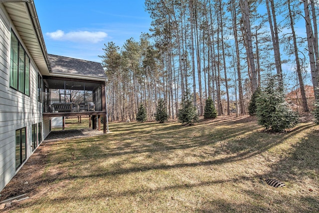 view of yard featuring a sunroom