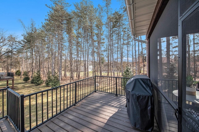 wooden terrace featuring area for grilling