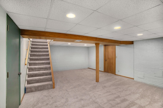 finished below grade area with concrete block wall, stairway, recessed lighting, and carpet