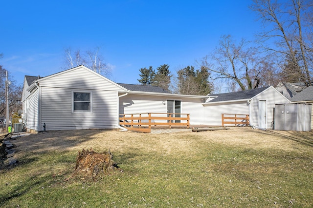 back of house with a yard, cooling unit, and a wooden deck