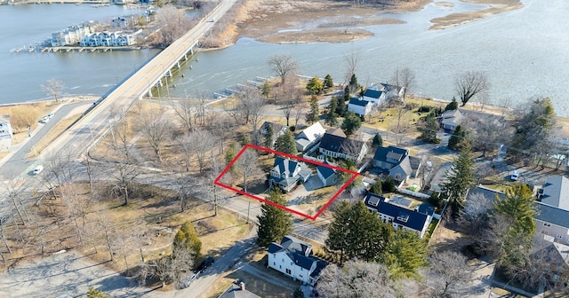 drone / aerial view featuring a residential view and a water view