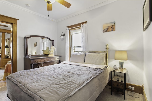 bedroom featuring ceiling fan, crown molding, carpet flooring, and baseboards