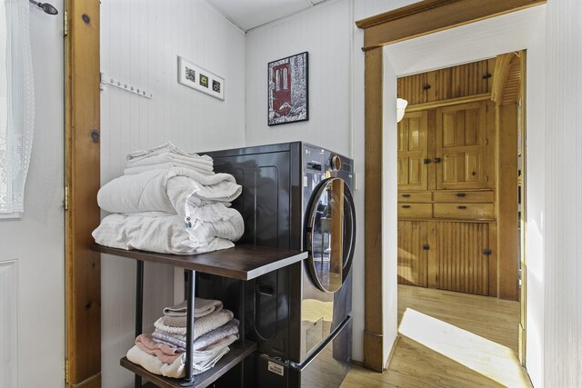 laundry room with laundry area and wood finished floors