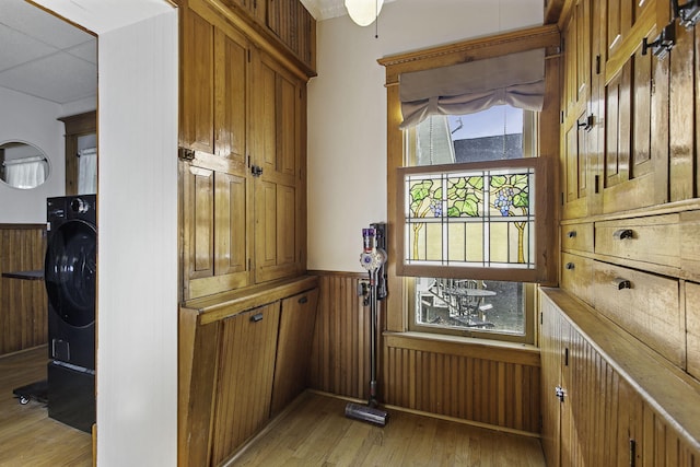 details with wainscoting, wood walls, and wood finished floors
