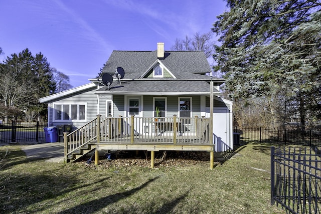 view of front facade with fence, roof with shingles, a chimney, and covered porch