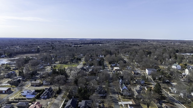 aerial view featuring a residential view and a wooded view