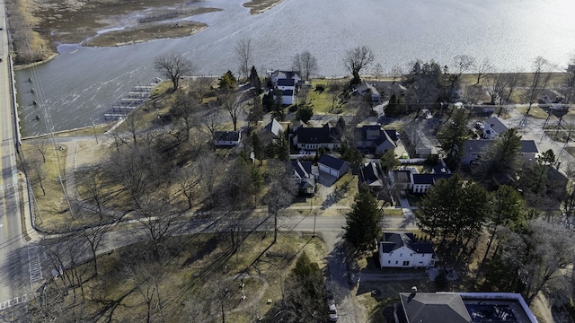 drone / aerial view with a residential view and a water view