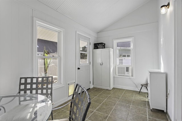 dining room with lofted ceiling