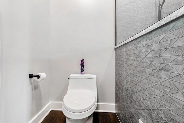 7505 S Lakeshore Dr, Pentwater, MI 49449 - bathroom with toilet, wood finished floors, and baseboards