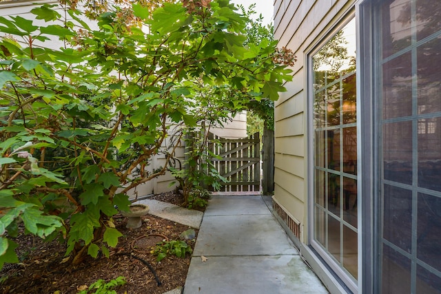 view of patio with a gate
