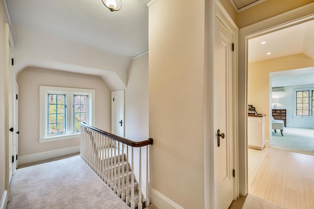 hall featuring light colored carpet, baseboards, an upstairs landing, and recessed lighting