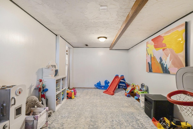 playroom with carpet and a textured ceiling