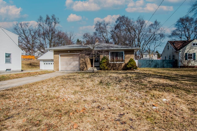 view of front of property with fence, an attached garage, concrete driveway, a front lawn, and brick siding