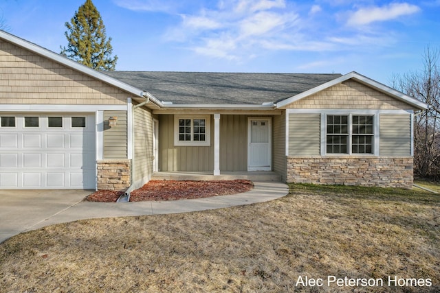 single story home with stone siding, a porch, roof with shingles, concrete driveway, and a garage